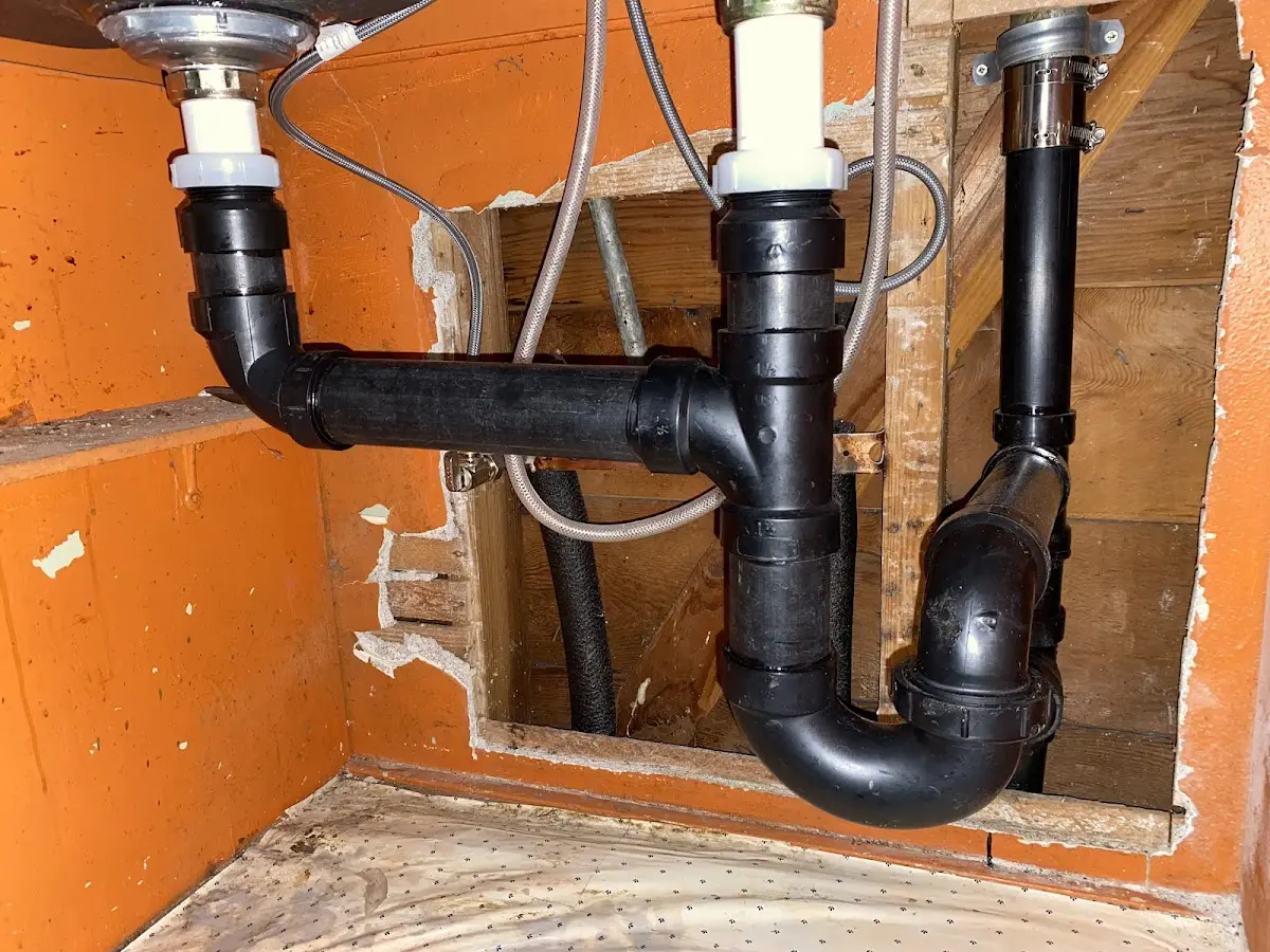 Professional Garbage Disposal Repair equipment and tools on the job in Madison